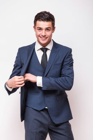 portrait-happy-smiling-young-businessman-blue-suit-isolated-white-wall